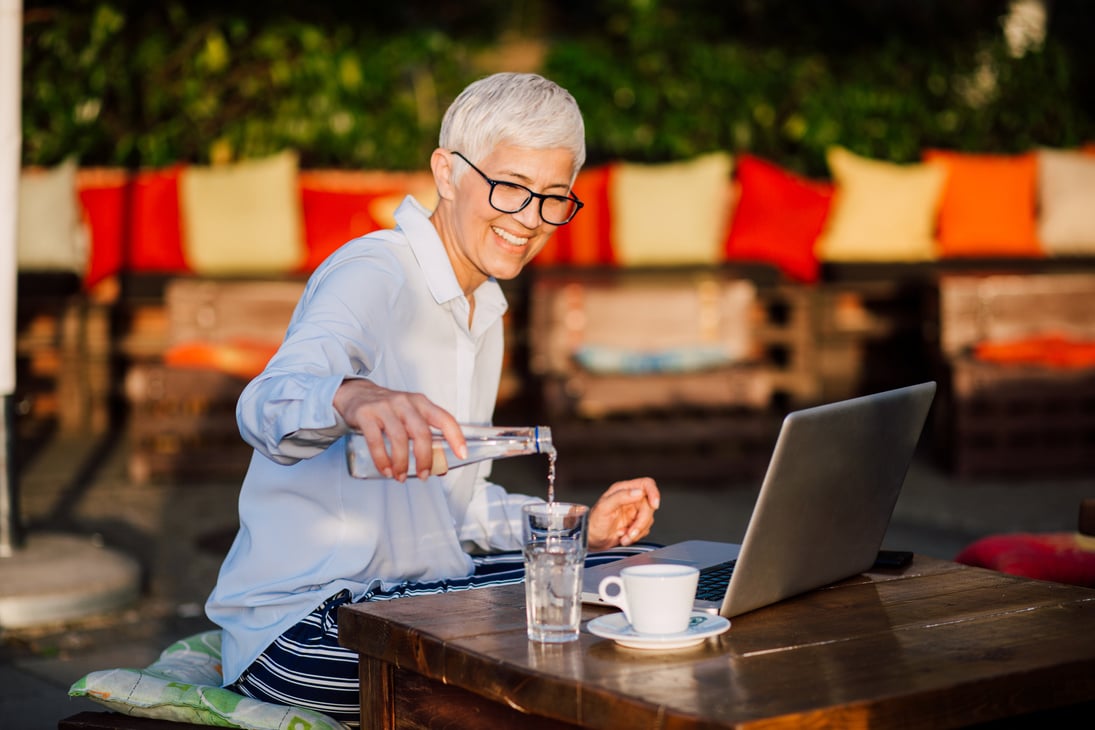 Business madam drinks water and coffee